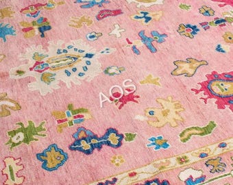 Alfombra Oushak de lana rosa anudada a mano, 9x12, estilo bohemio artesanal, ideal para decorar el suelo del salón.