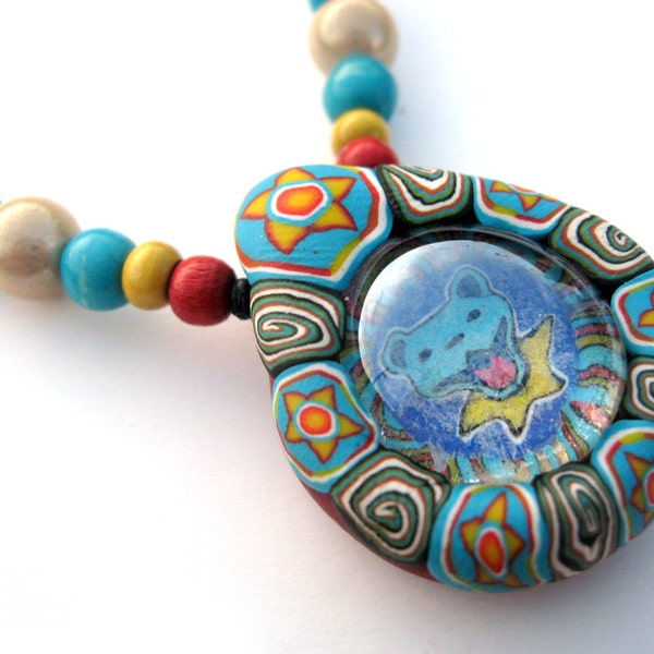 Grateful Dead dancing bear pendant handmade from polymer clay and glass in bright colors, millefiori patterns, tribal stars and spirals