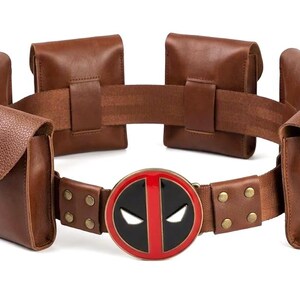 May include: A white ceramic mug with a black handle and the text "But First, Coffee" in a black, bold font. The mug is on a white surface. The mug is approximately 4 inches tall.