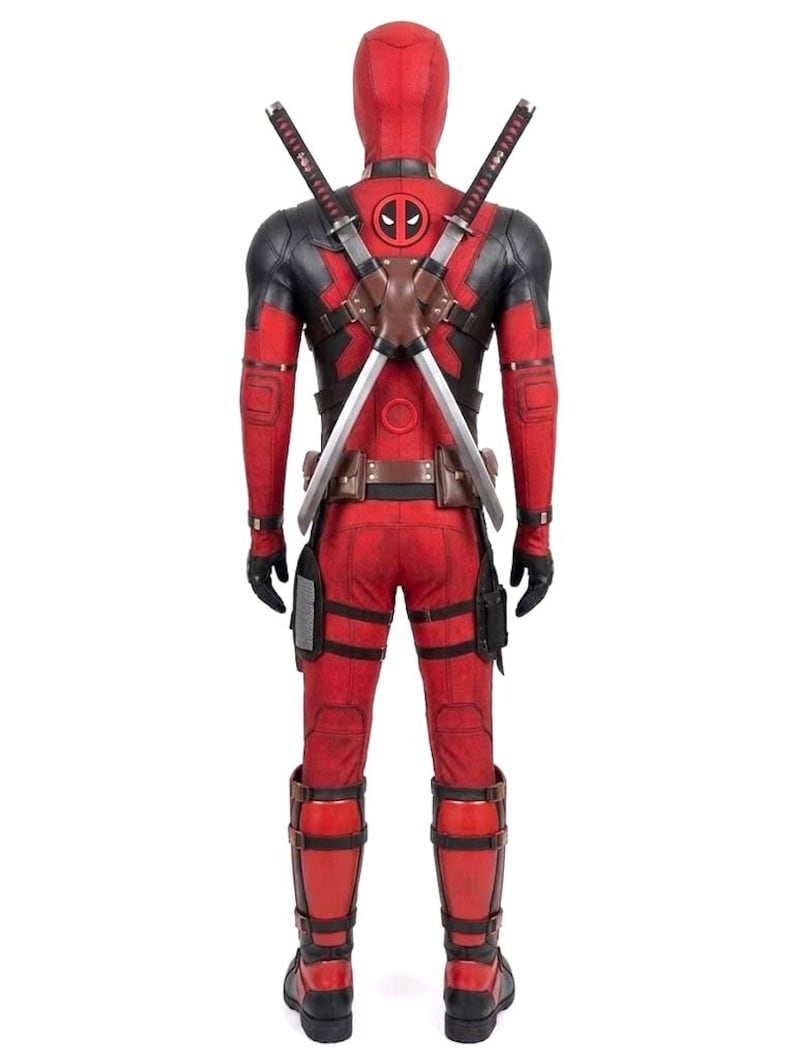 May include: Red and black Deadpool costume with a mask, featuring a chest emblem and two katana swords strapped to the back. The costume includes gloves, boots, and a utility belt. The overall design is a detailed replica of the character's attire.