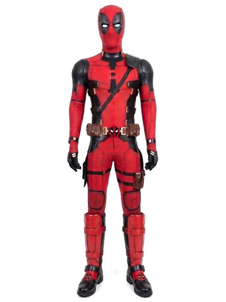 May include: A full-body costume of the Marvel Comics character Deadpool. The costume is primarily red with black accents, including a mask with white eyes, black gloves, and a utility belt. The boots are black and red.