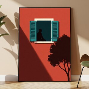 May include: A framed wall art print featuring a vibrant red wall with a centered window. The window has open teal shutters and a dark silhouette of a person sitting inside. A dark tree silhouette is visible on the right side of the red wall.