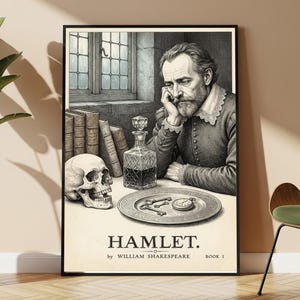 Op de afbeelding: Een ingelijste poster met een zwart-witillustratie van een man met een baard die zijn hoofd op zijn hand laat rusten. Naast hem staan een menselijke schedel, boeken, een glazen karaf en een bord met sleutels en een zakhorloge. De tekst luidt HAMLET. by WILLIAM SHAKESPEARE BOOK 1.