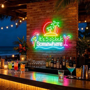 May include: A vibrant neon sign reading "It's 5 o'clock Somewhere" in a bar setting. The sign includes a parrot, palm trees, and a cocktail. The bar has a bamboo front and a selection of cocktails.