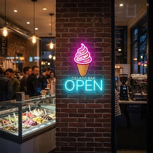 May include: A neon sign mounted on a brick wall featuring a pink and white soft serve ice cream cone graphic above the text GELATO BAR OPEN in bright cyan. The sign illuminates the surrounding area, displaying a vibrant visual display.