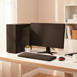 May include: A black computer monitor, keyboard wrist rest, and computer tower on a white desk. A small succulent in a white pot sits between the monitor and tower. A red and black mouse and a white coffee cup are also on the desk.