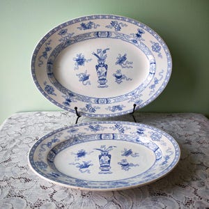 May include: A set of three ceramic mugs with a speckled, matte finish. The mugs are in shades of cream, light gray, and dark gray. Each mug has a simple, minimalist design, perfect for coffee or tea.