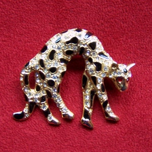 ELEGANT CHEETAH BROOCH - Gold Plated with All-over Simulated Pave&#39;  & Black Enamel - Red Rhinestone Eyes