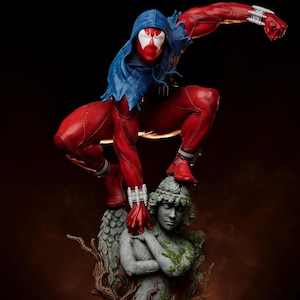 May include: A red and blue action figure of a superhero in a dynamic pose, perched atop a stone statue. The figure wears a red suit with a blue hood and white mask. The statue is of a woman with vines.