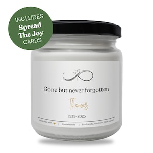 May include: A white soy wax candle in a glass jar with a black lid. The label reads "Gone but never forgotten" with the name "Thomas" and dates 1939-2025. Includes "Spread The Joy Cards".