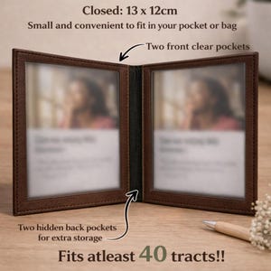 May include: Open brown leather photo album with two clear front pockets. The album is open, revealing two photo slots. The text on the image says "Fits at least 40 tracts!!" and "Closed: 13 x 12cm". The album is 13cm x 12cm when closed.