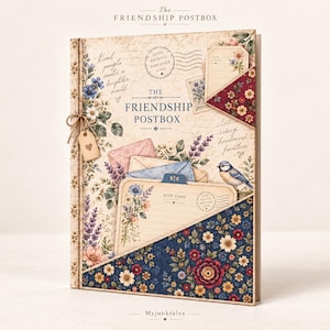 May include: A vertical scrapbook or journal titled The Friendship Postbox, featuring a vintage-style cover with floral illustrations, a blue bird, envelopes, and postcards. The cover includes a small hanging tag with a heart and dark blue floral pockets.
