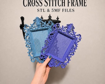 May include: Two ornate, rectangular cross stitch frames with intricate scrollwork borders, one in light blue and one in dark purple. The text reads CROSS STITCH FRAME STL & 3MF FILES and DIGITAL DOWNLOAD. These are digital files for 3D printing.