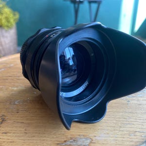 May include: A set of three ceramic mugs with a speckled, matte finish. The mugs are in shades of cream, light gray, and dark gray. Each mug has a simple, minimalist design, perfect for coffee or tea.