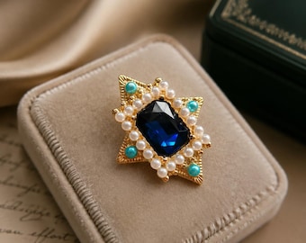 Vintage blauwe saffiersterbroche, goudkleur met parel en turkoois, vorstelijke statementspeld