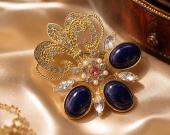 Vintage fleur-de-lis-broche, goudkleur met lapis lazuli en kristal, vorstelijke statementspeld