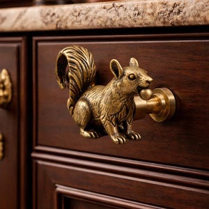 May include: A white ceramic mug with a black handle and the text "But First, Coffee" in a bold, black font. The mug is sitting on a wooden surface. The mug is 4 inches tall.