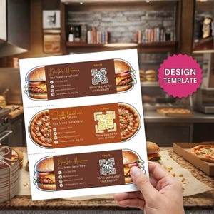 May include: Printed business cards with burger and pizza designs. The cards have a brown and white colour scheme and include the text "Bite Into Happiness" and "Freshly baked with love, just for you." Includes a QR code.