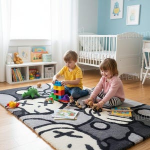 May include: A children's playroom with a large gray, white, and black patterned rug. Two children are playing with toys, including building blocks and wooden cars. A white crib and blue wall with framed art are in the background.