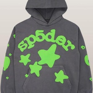 May include: A white ceramic mug with a black handle and the text "But First, Coffee" in a handwritten style. The mug is on a white surface. The mug is likely for hot beverages.