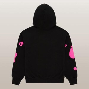 May include: Black hoodie with a hood and long sleeves. The sleeves feature a pink graphic design. The hoodie is made of a soft material and is suitable for casual wear. The back view of the hoodie is shown.