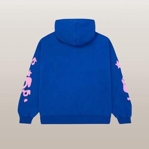May include: A royal blue hoodie with a matching hood and cuffs. The sleeves feature pink graphic designs. The hoodie is made of a soft material and is suitable for casual wear.