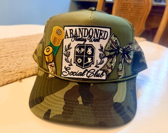 Abandoned Hunting Wives Social Club Camo Trucker Hat • Embroidered Statement Patch Snapback