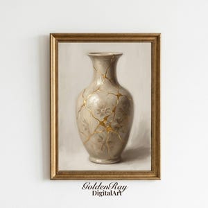 May include: A framed print of a vase with a Kintsugi design. The vase is a light beige color with gold-colored lines. The vase has a floral pattern. The frame is gold-colored. The text "Golden Ray Digital Art" is at the bottom.