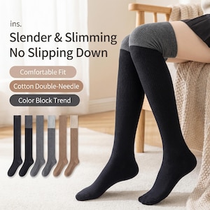 May include: Black and gray over-the-knee socks with a ribbed texture. The socks have a color block design at the knee and are displayed with text that reads "Slender & Slimming No Slipping Down". Additional socks in black, gray, and brown are shown.