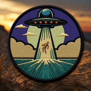 May include: Embroidered patch featuring a UFO beaming up a person. The design includes a blue sky, clouds, and a green and teal beam. The patch is circular with a black border and is set against a natural, textured background.