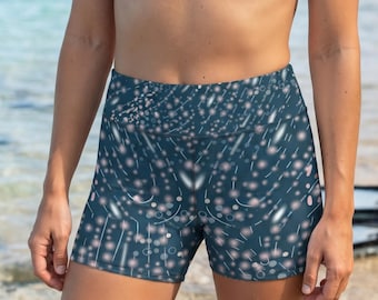 May include: A dark teal bikini top with triangle cups and thin straps paired with high-waisted athletic shorts featuring a dark teal base color and a repeating pattern of small, light-colored circular dots and short, thin, white vertical streaks.