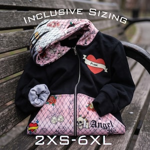 May include: A black zip-up hoodie featuring a pink hood lining and bottom panel with a black diamond pattern, tattoo-style graphics of skulls, roses, dice, and hearts, and the text "PUNK" and "Angel". The text "INCLUSIVE SIZING 2XS-6XL" is visible.