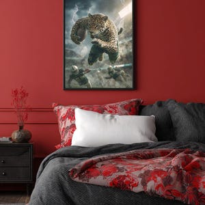 May include: Framed artwork depicting a jaguar playing American football. The image shows the jaguar mid-air, holding the ball, with a stadium and lightning in the background. The artwork hangs above a bed with red and grey bedding.
