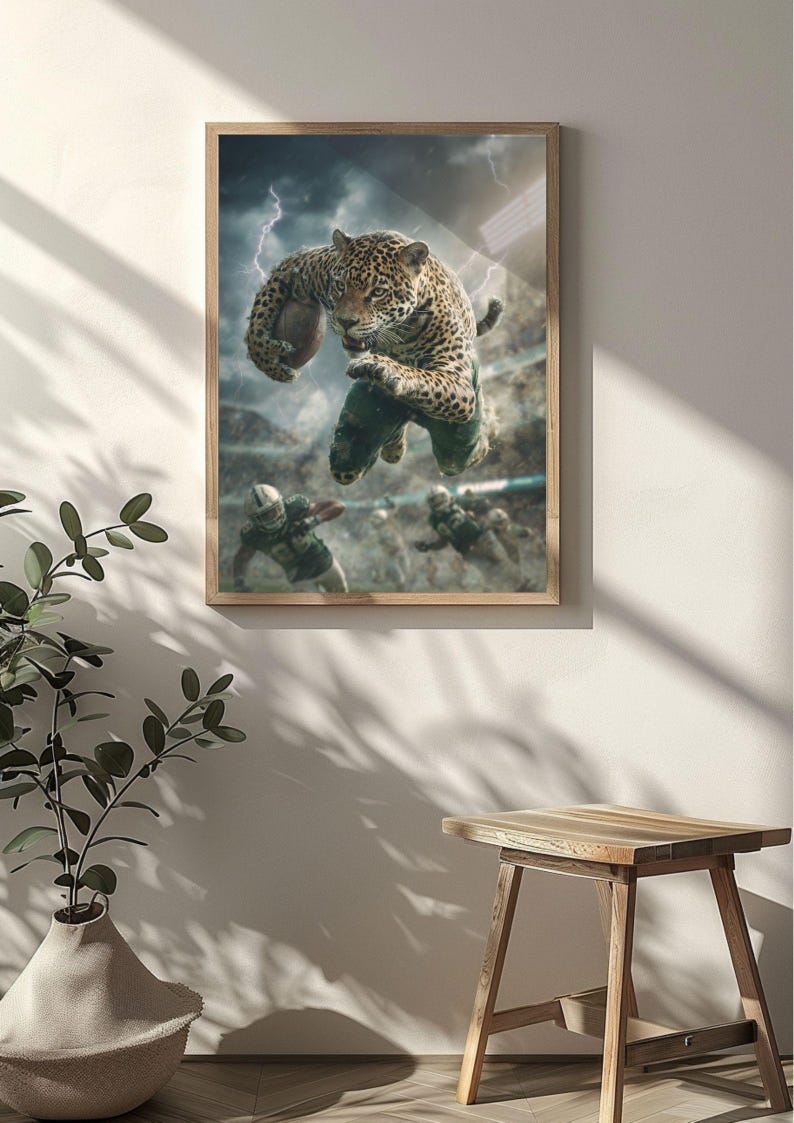 May include: A framed print shows a jaguar leaping in a football stadium, holding a football. The jaguar is wearing a green uniform. Lightning flashes in the background. Other football players are visible in the background.
