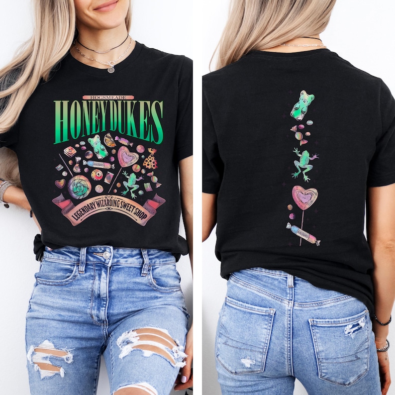 May include: Black t-shirt with a colorful graphic of sweets and the text "HONEYDUKES" and "Legendary Wizarding Sweet Shop". The back of the shirt features a gummy bear, frog, heart lollipop, and candy.