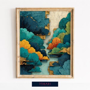 May include: Abstract art print in a gold frame. The artwork features stylized clouds in shades of teal, blue, orange, and yellow with gold accents. The bottom of the frame has the text "Hikari" in white on a dark blue background.