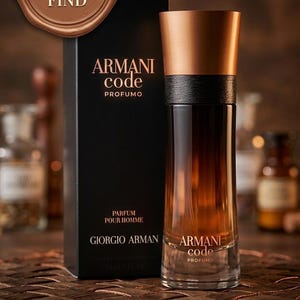May include: A bottle of Armani Code Profumo perfume with a black box. The bottle is a gradient of brown and clear glass with a copper-colored cap. The box reads "Armani Code Profumo" and "Parfum Pour Homme". The text "Rare Vintage Find" is also present.