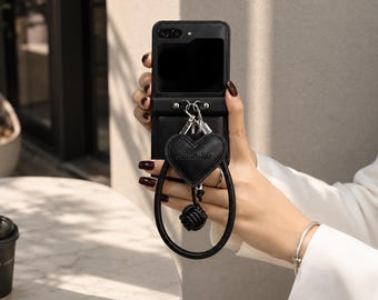 Funda de cuero negro con forma de corazón para Samsung Z Flip 5/6/7 / Funda con correa antipérdida