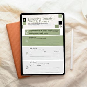 May include: A digital tablet displaying an "Executive Function Weekly Planner" with sections for weekly goals, task planning, and focus blocks. The tablet is next to an orange notebook and a white stylus on a beige surface.