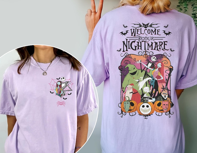 May include: A light purple t-shirt featuring a graphic from "The Nightmare Before Christmas." The front has a small design of Jack and Sally. The back has a larger design with the text "Welcome to our Nightmare" and characters from the movie.