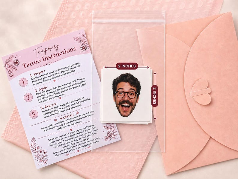 May include: A square temporary tattoo featuring a smiling person with dark hair, a beard, and glasses, measuring 2 inches by 2 inches. The set includes a printed instruction card detailing preparation, application, and removal steps for the tattoo.