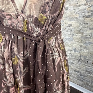 May include: A rustic wooden sign with the text "Welcome to our home" in white lettering. The sign features a distressed finish and a simple, inviting design, perfect for entryway decor.