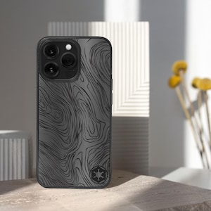 May include: A set of three ceramic mugs with a speckled, matte finish. The mugs are in shades of cream, light gray, and dark gray. Each mug has a simple, minimalist design, perfect for coffee or tea.