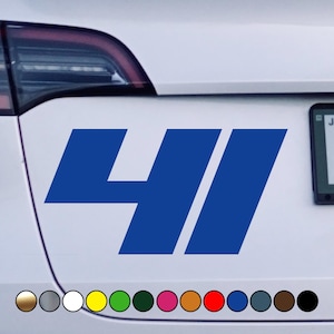 May include: A blue vinyl decal featuring the number "41" in a bold, stylized font. The decal is affixed to a white vehicle. A row of color swatches is visible at the bottom.