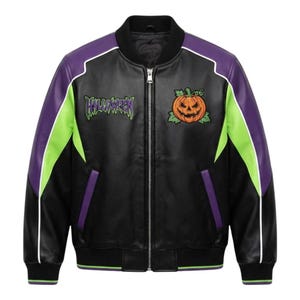 May include: A black bomber jacket featuring purple and lime green color-blocked sleeves with white piping. The chest displays an embroidered orange jack-o'-lantern and the word HALLOWEEN in a stylized purple and green font with a front zipper.