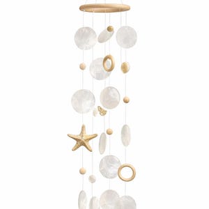 May include: A coastal-themed wind chime featuring a wooden ring and various shapes, including round, oval, and starfish. The chime includes white, pearlescent discs, wooden beads, and a small butterfly accent, all suspended by thin strings.