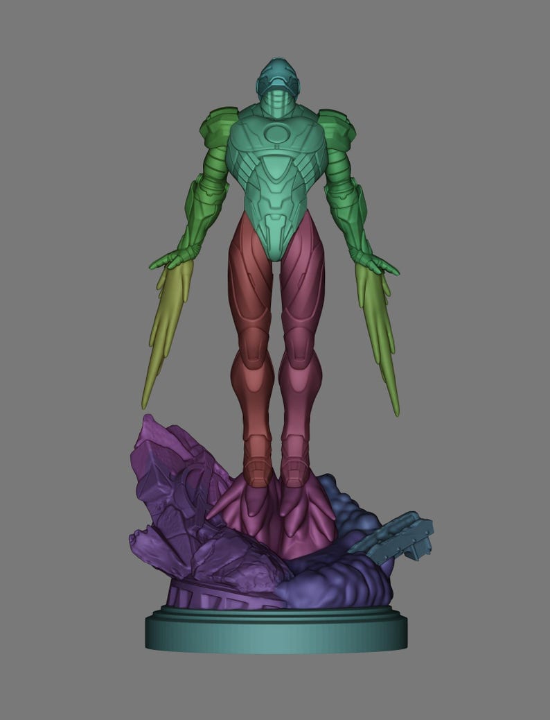 May include: A multi-colored figurine of a humanoid robot with outstretched arms and stylized wings. The robot is standing on a purple and blue rocky base. The robot's body is a gradient of green, blue, and red.