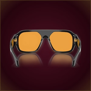 May include: Sunglasses featuring a thick, glossy black frame with a flat top bar and a bridge that connects the two lenses. The lenses are a vibrant, solid orange color. The hinges on the sides of the frame are visible and metallic in appearance.