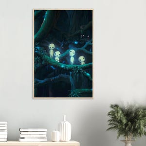 May include: A framed art print featuring a fantasy forest scene. The artwork depicts several small, white, humanoid figures with large, round eyes standing on a mossy branch. The background is a dark, lush forest with glowing accents.
