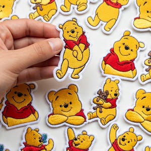 May include: A trio of ceramic mugs with a speckled, matte finish in light blue, cream, and grey. The mugs have a simple, modern design, suitable for coffee or tea.